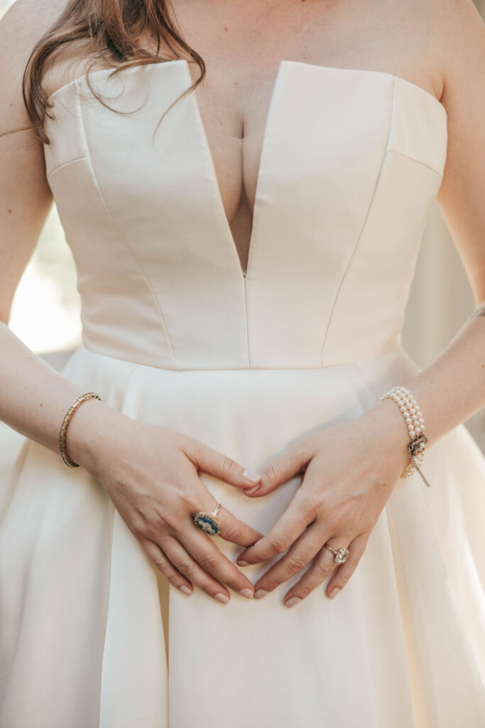 Pearl bracelet and gold ring styled with vintage-inspired bridal accessories.