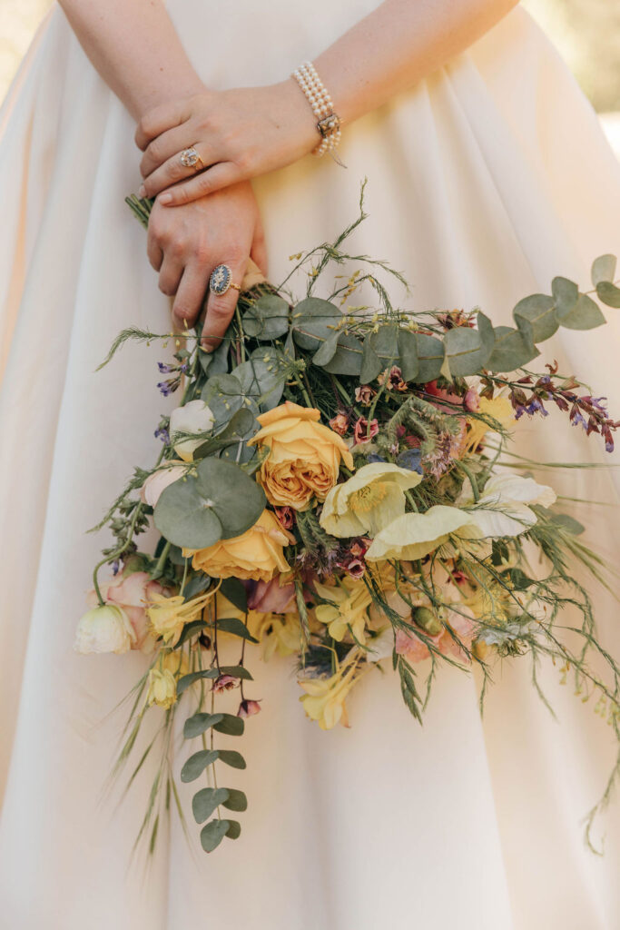 Vintage-Inspired Wedding florals featuring classic roses and textured greenery.”