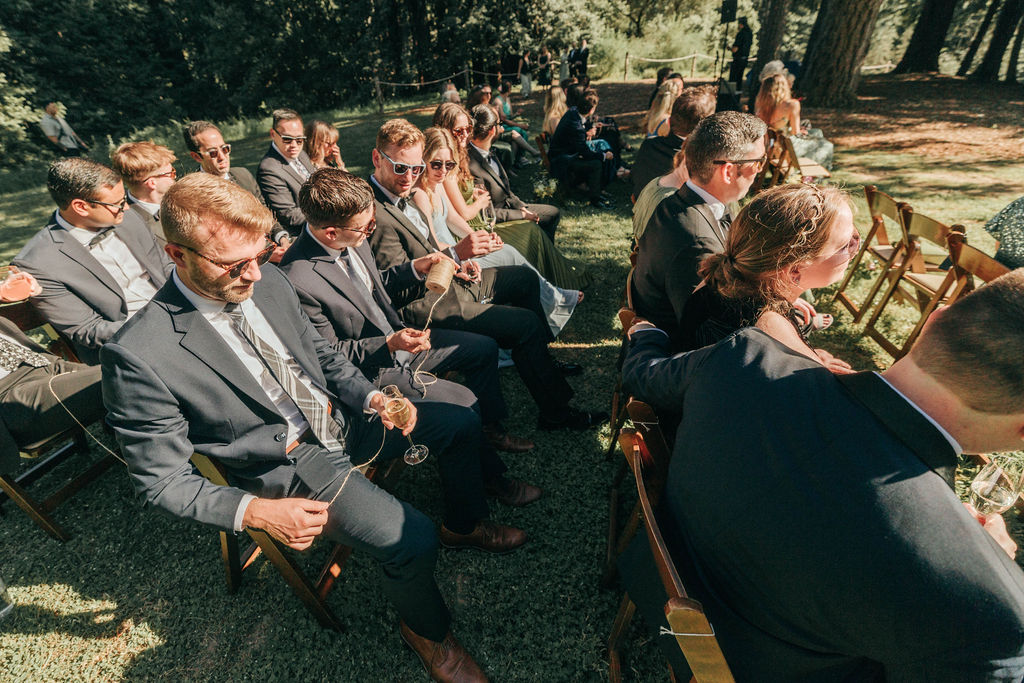 Wedding rings traveling along a ceremonial thread during the ring-warming tradition.