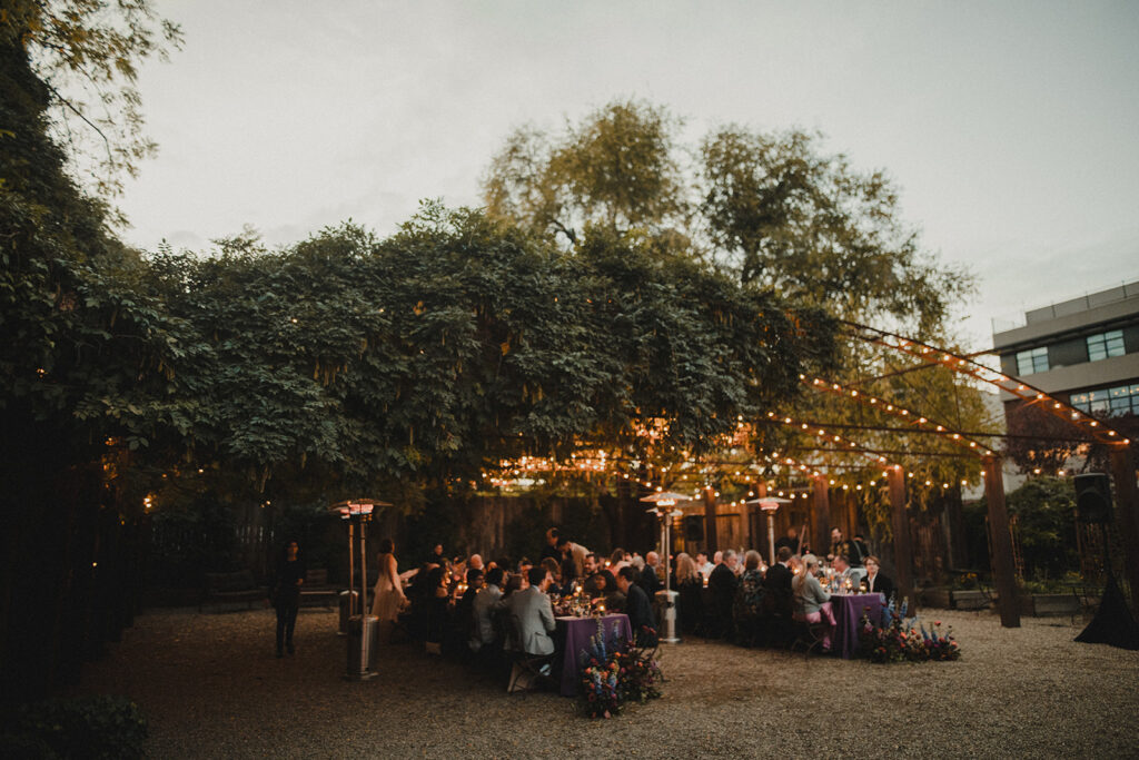 Friends and family mingling during the welcome dinner under the stars.